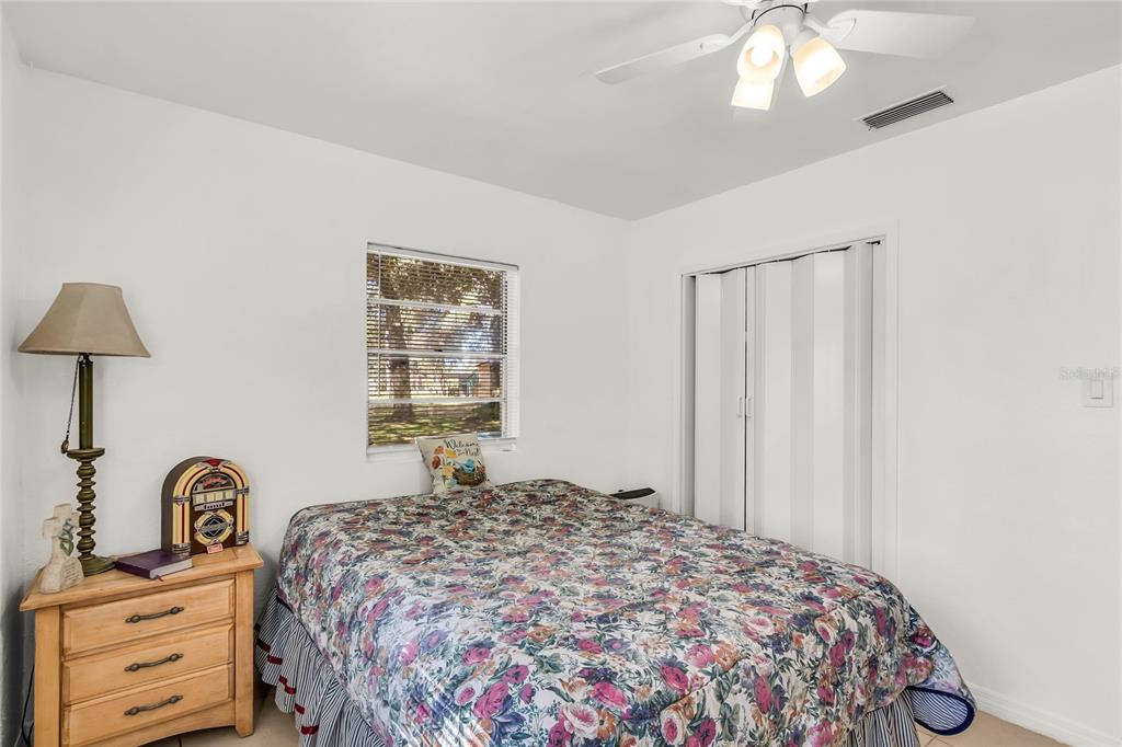 5012 West C 476 Bushnell, FL 33513 - Photo 26 of 42 a bedroom with a bed and a dresser