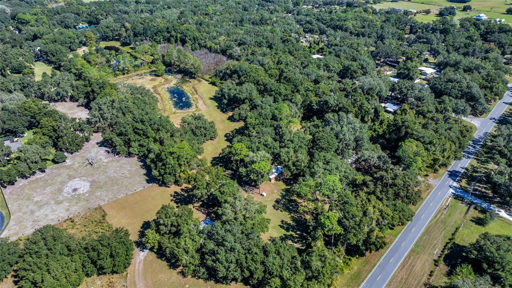 5012 West C 476 Bushnell, FL 33513 - Photo 39 of 42 an aerial view of residential house with outdoor space and trees all around