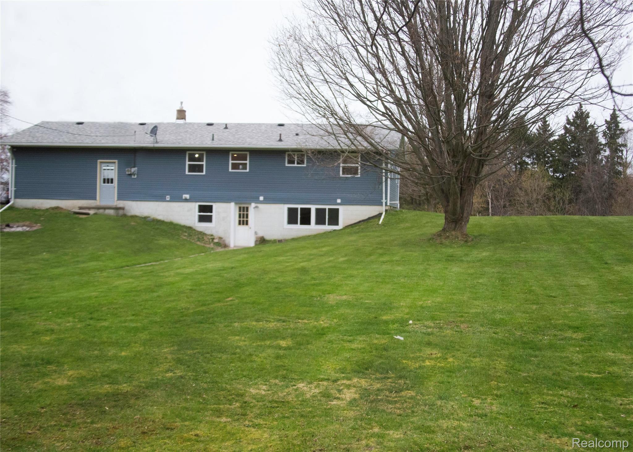 5925 Mason Road Fowlerville, MI 48836 - Photo 17 of 19 masonback of house1.jpg