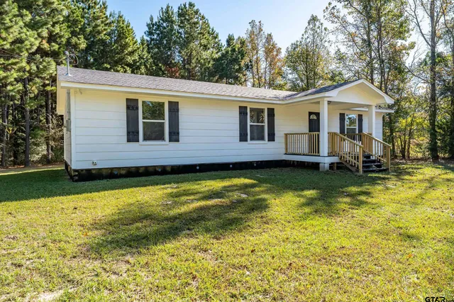 a view of a house with swimming pool