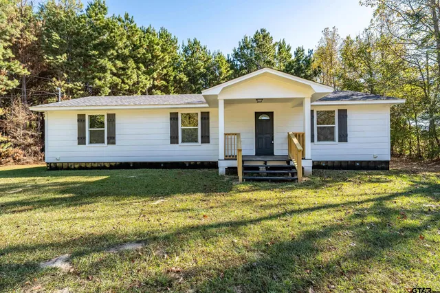 a kitchen with a stove and a microwave