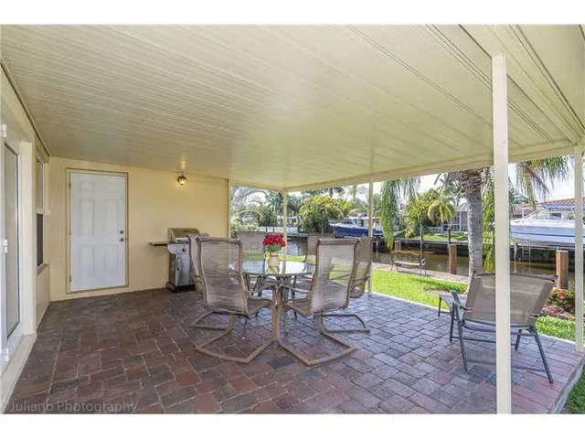 a view of a dining room with furniture and a table & chairs