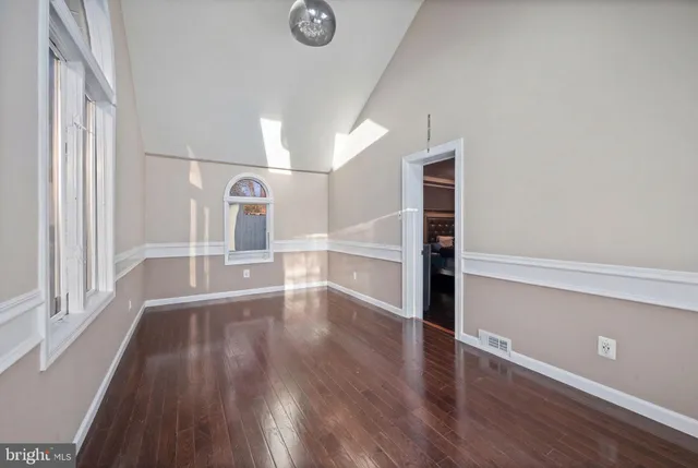 a view of a balcony with stairs and wooden floor