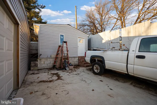 a view of a porch with wooden floor and stairs