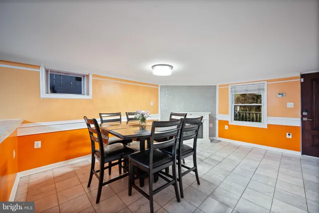 a view of a dining room with furniture and a window