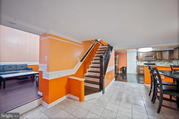 a view of entryway and hall with dining room