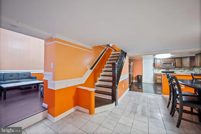 a view of entryway and hall with dining room