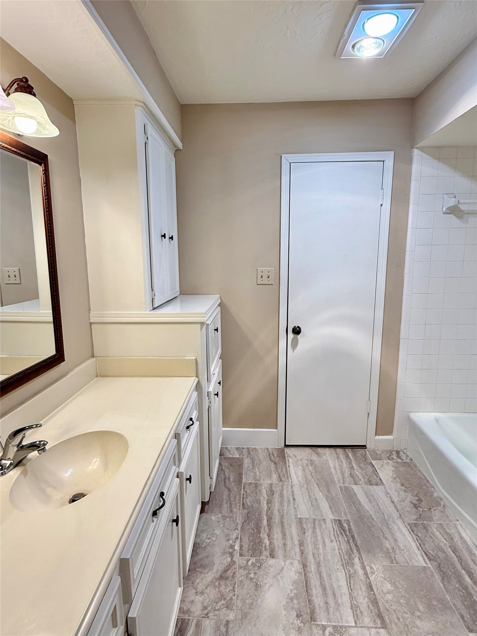 16711 Sir William Drive Spring, TX 77379 - Photo 14 of 21 a bathroom with a granite countertop sink a mirror and shower