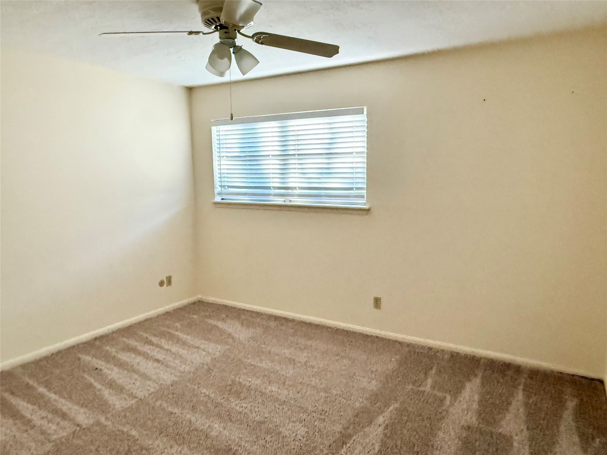 16711 Sir William Drive Spring, TX 77379 - Photo 16 of 21 a view of an empty room with a window