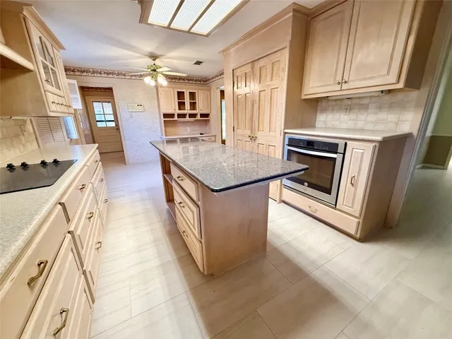 a kitchen with stainless steel appliances granite countertop a stove and a sink