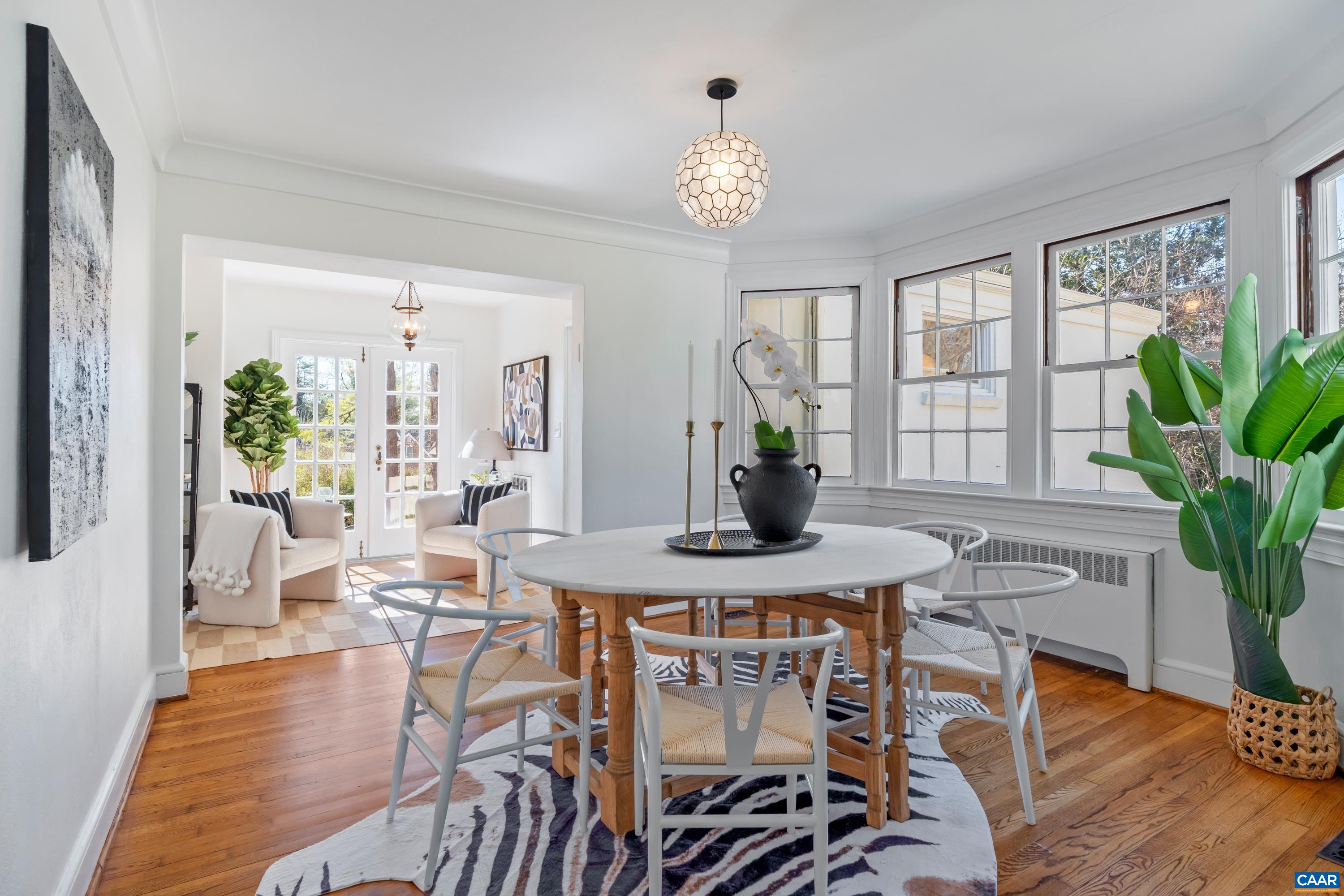 12 Old Farm Road Charlottesville, VA 22903 - Photo 13 of 39 a view of a dining room with furniture window and wooden floor