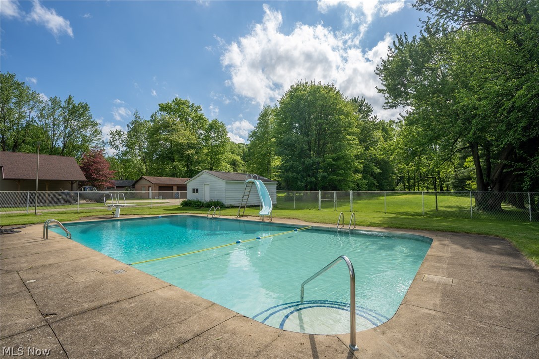 5644 Myers Road Akron, OH 44319 - Photo 5 of 33 Inground pool with diving board and slide. Pool ranges from 3 ft. to 10 ft. deep.
