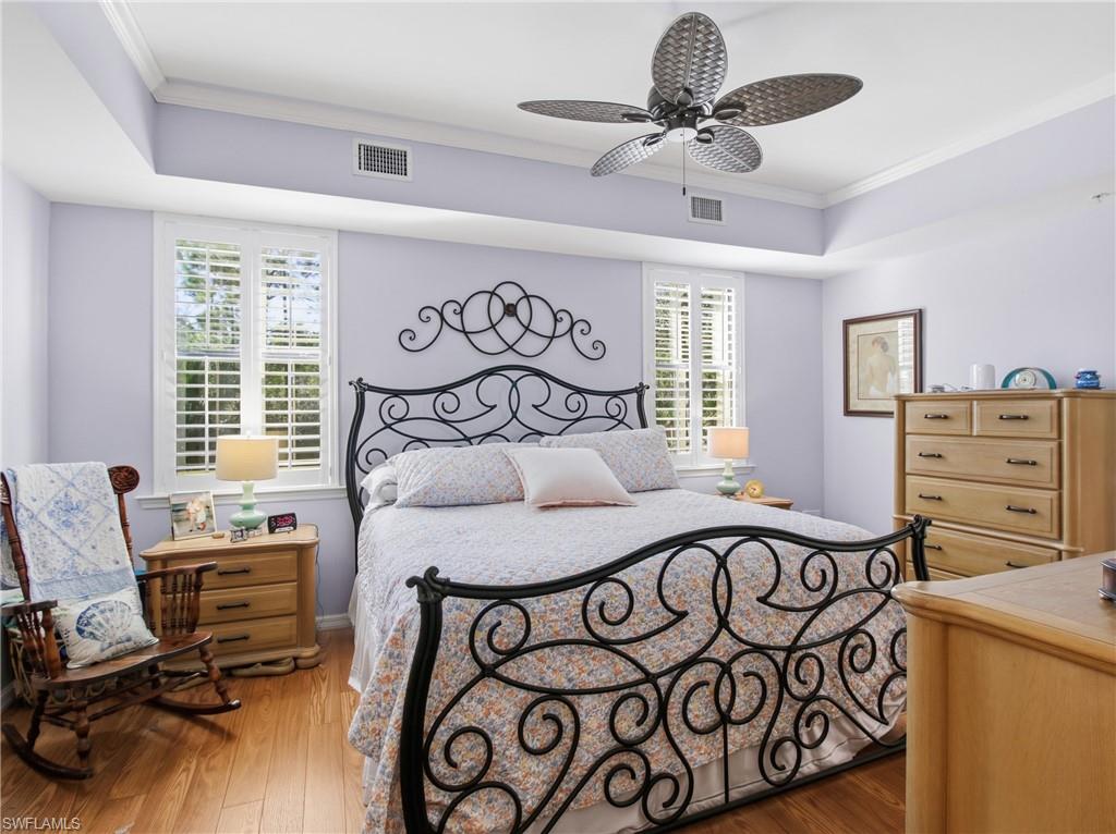 20161 Bravada Street, Unit 2 Estero, FL 33928 - Photo 16 of 34 Bedroom with ornamental molding, dark wood finished floors, and ceiling fan