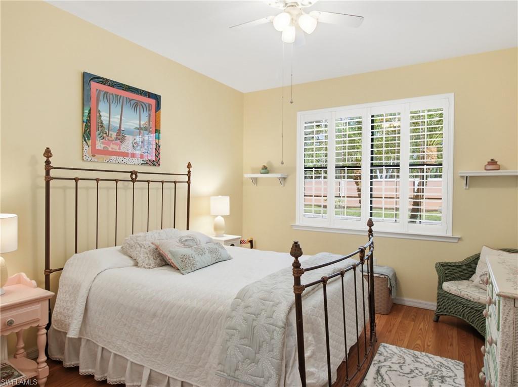 20161 Bravada Street, Unit 2 Estero, FL 33928 - Photo 18 of 34 Bedroom featuring wood finished floors and ceiling fan