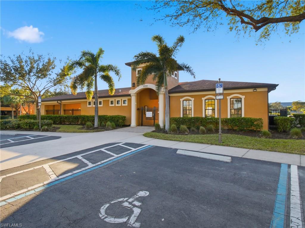 20161 Bravada Street, Unit 2 Estero, FL 33928 - Photo 28 of 34 View of property featuring uncovered parking