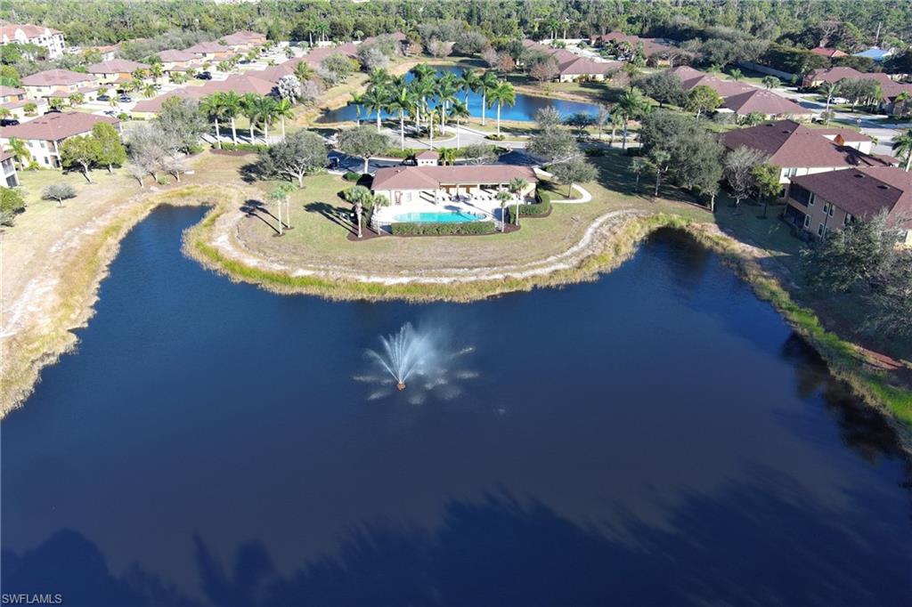 20161 Bravada Street, Unit 2 Estero, FL 33928 - Photo 29 of 34 Aerial view of property and surrounding area featuring a large body of water and nearby suburban area