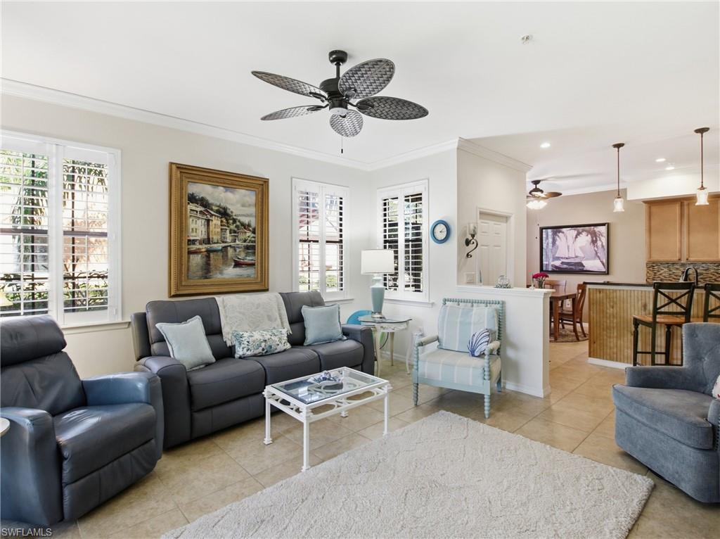 20161 Bravada Street, Unit 2 Estero, FL 33928 - Photo 7 of 34 Living area featuring ornamental molding, ceiling fan, and light tile patterned floors
