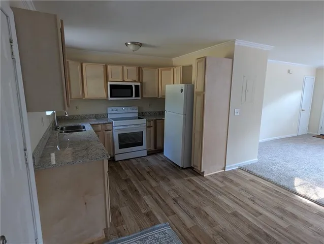 an empty room with a empty space and windows