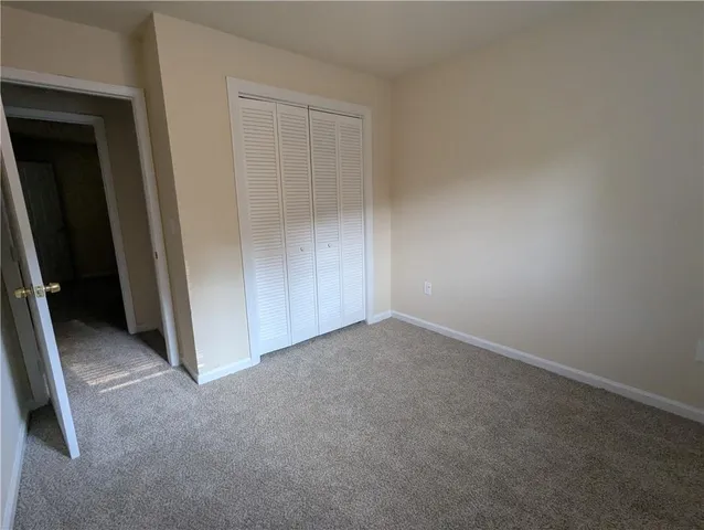 an empty room with a empty space and windows