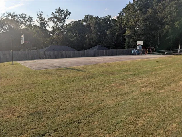 a view of a balcony with chairs and potted plants