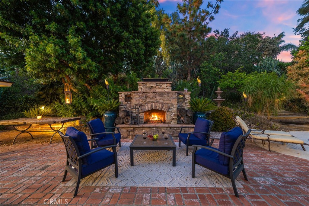 a backyard of a house with table and chairs