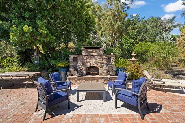 a backyard of a house with table and chairs