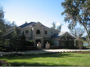 0 Northwest 31st Lane Road Ocala, FL 34482 - Photo 1 of 1 a front view of a house with a yard and garage