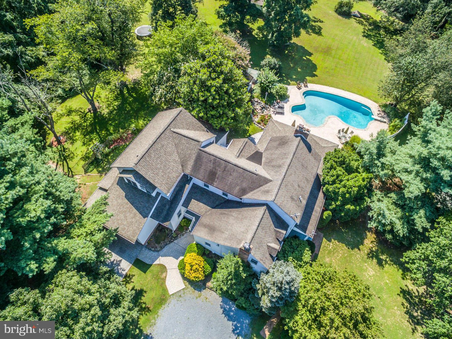 3900 Chaneyville Road Owings, MD 20736 - Photo 2 of 30 an aerial view of a house with swimming pool and garden space