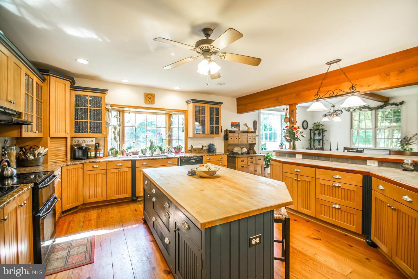 3900 Chaneyville Road Owings, MD 20736 - Photo 11 of 30 a kitchen with stainless steel appliances granite countertop sink stove top oven and cabinets