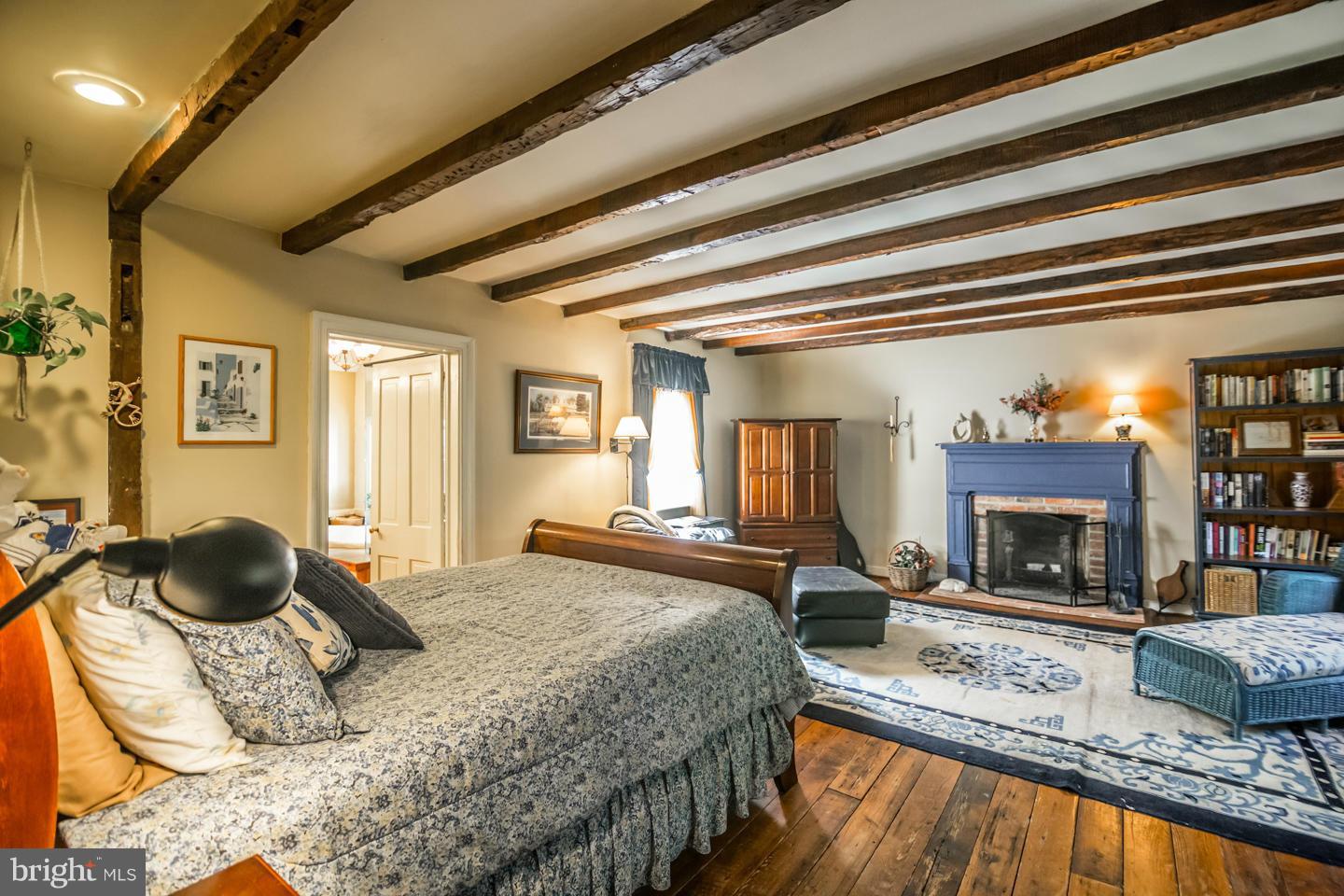 3900 Chaneyville Road Owings, MD 20736 - Photo 13 of 30 a bedroom with a bed and ceiling fan
