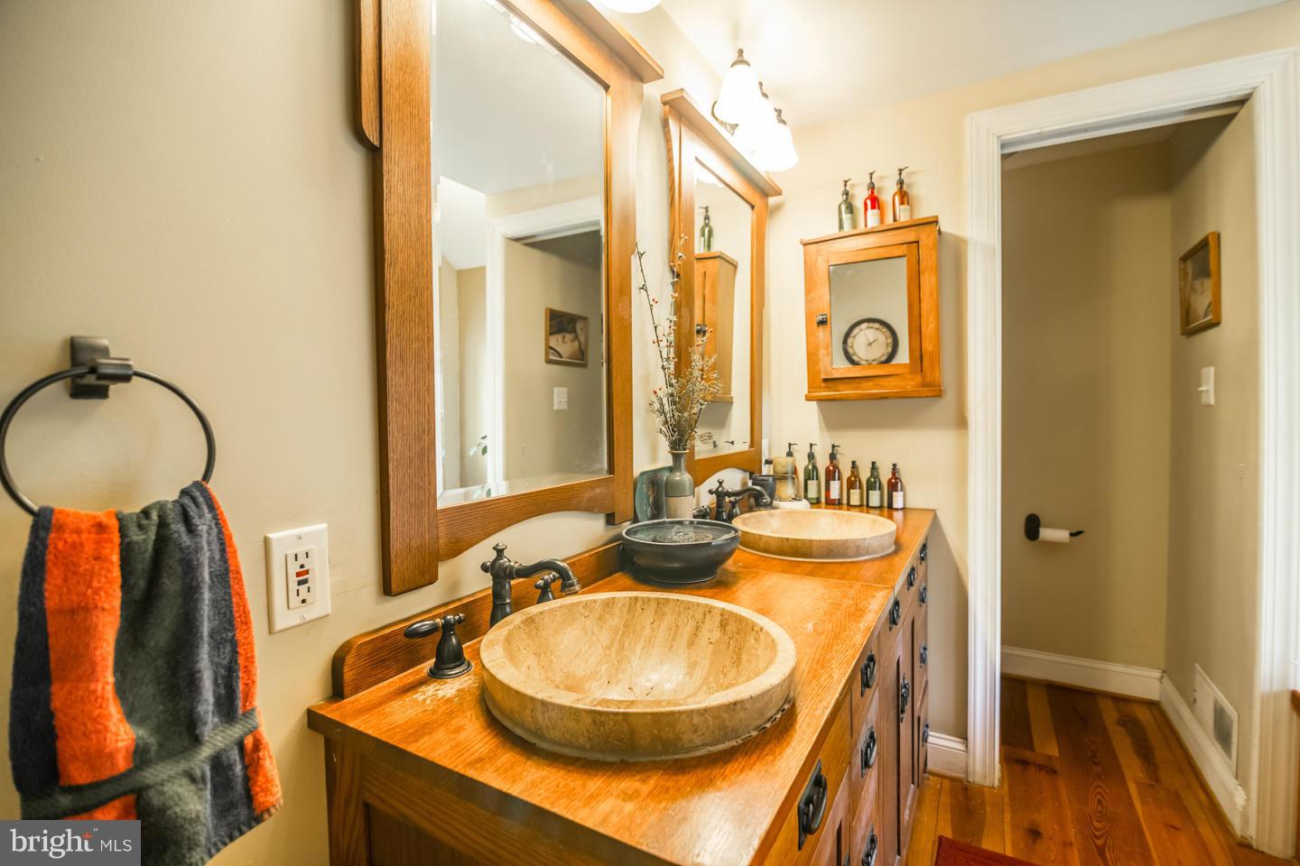 3900 Chaneyville Road Owings, MD 20736 - Photo 15 of 30 a bathroom with a sink and a mirror