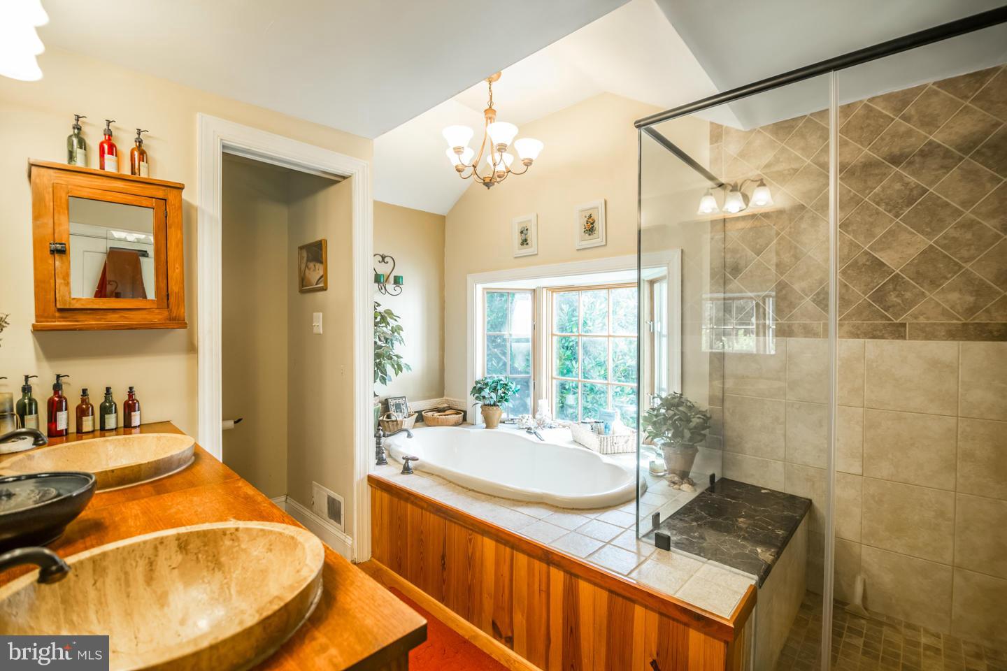 3900 Chaneyville Road Owings, MD 20736 - Photo 16 of 30 a bathroom with a sink and a mirror
