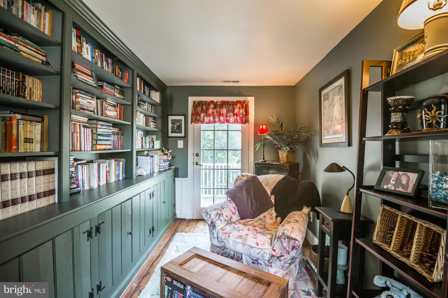 3900 Chaneyville Road Owings, MD 20736 - Photo 18 of 30 a living room with furniture a bookshelf and a window