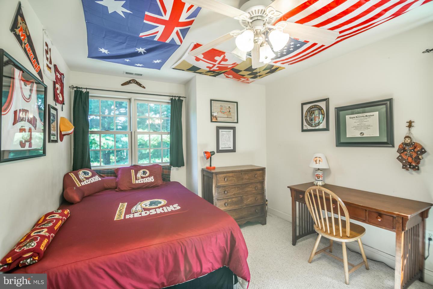 3900 Chaneyville Road Owings, MD 20736 - Photo 20 of 30 a bedroom with a bed and wooden floor