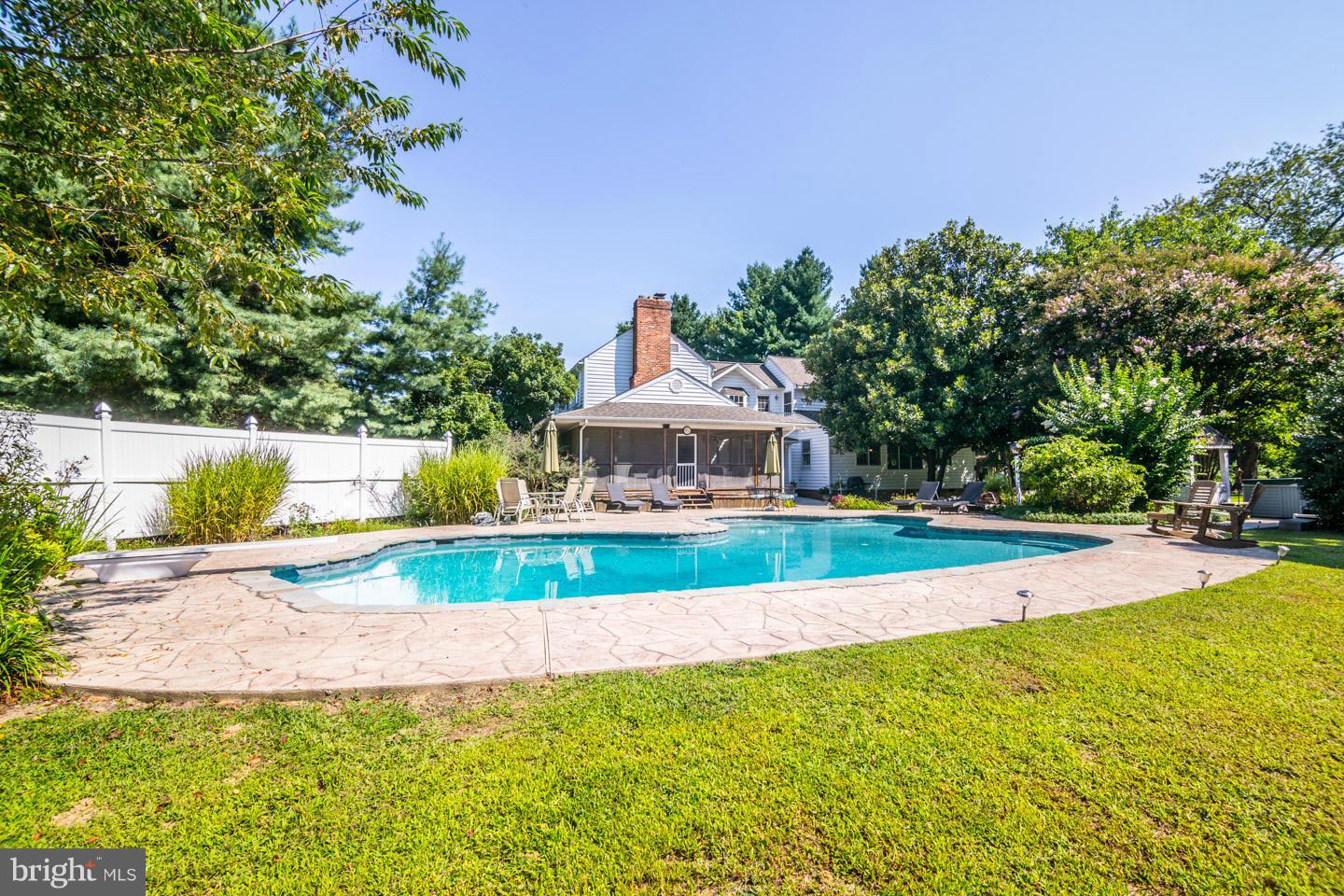3900 Chaneyville Road Owings, MD 20736 - Photo 23 of 30 a front view of a house with a yard and fountain