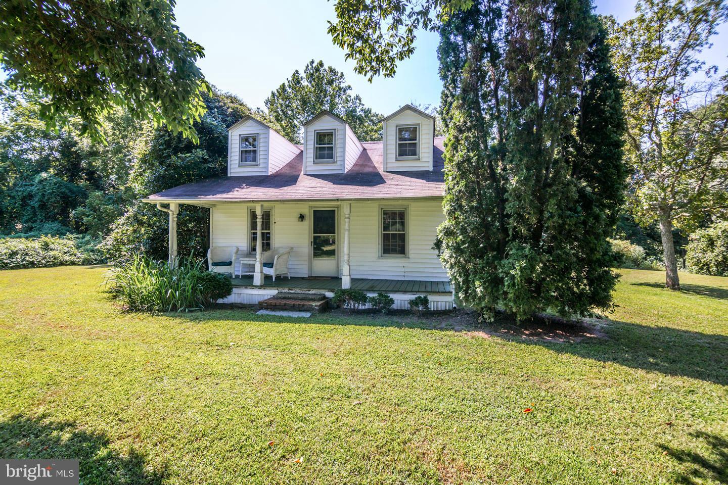3900 Chaneyville Road Owings, MD 20736 - Photo 25 of 30 a view of a house with swimming pool and a chairs