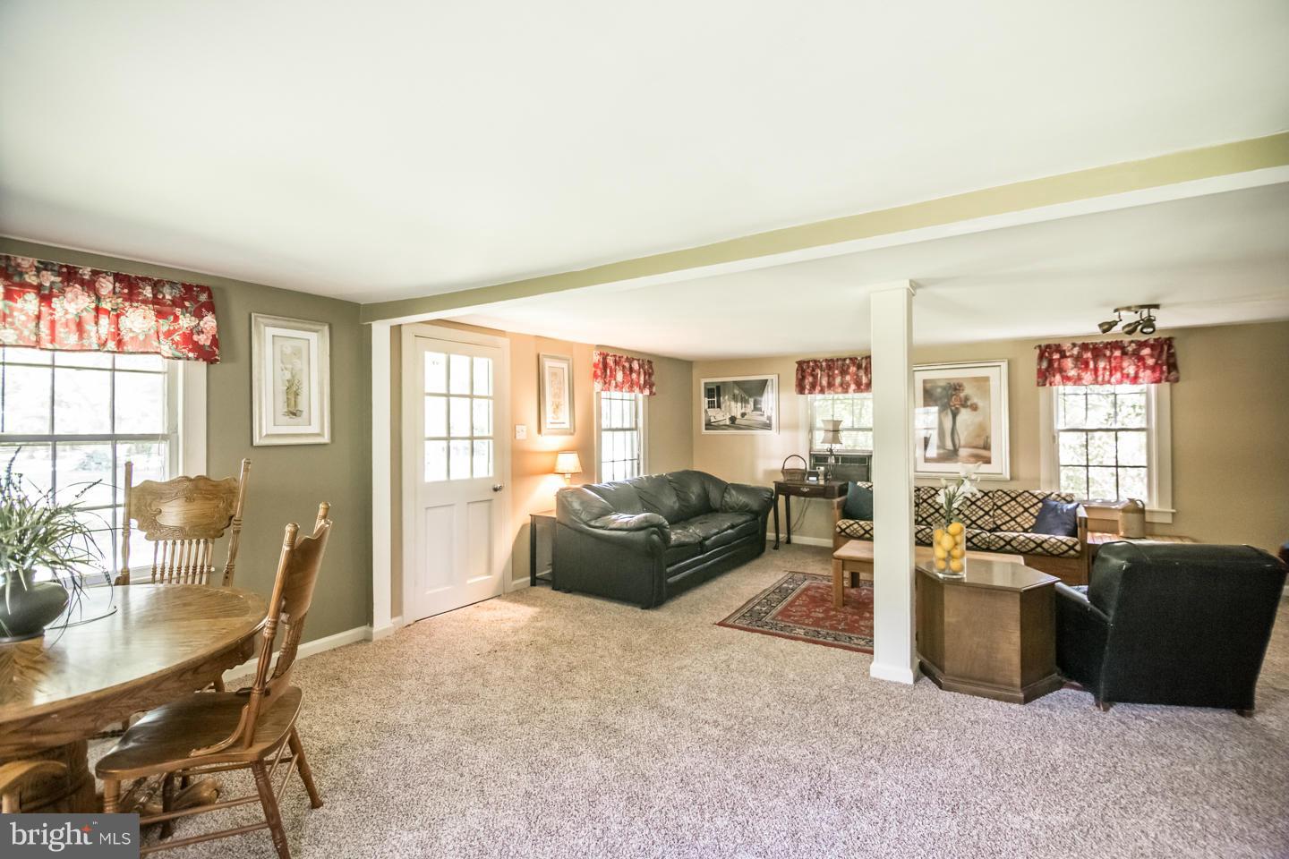 3900 Chaneyville Road Owings, MD 20736 - Photo 26 of 30 a living room with furniture a flat screen tv and a large window