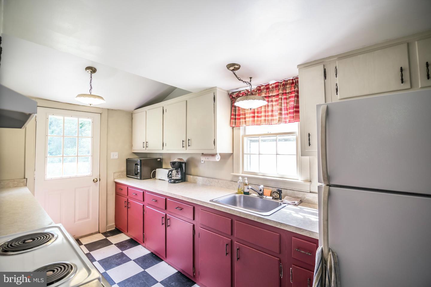 3900 Chaneyville Road Owings, MD 20736 - Photo 27 of 30 a kitchen with a sink stove and refrigerator