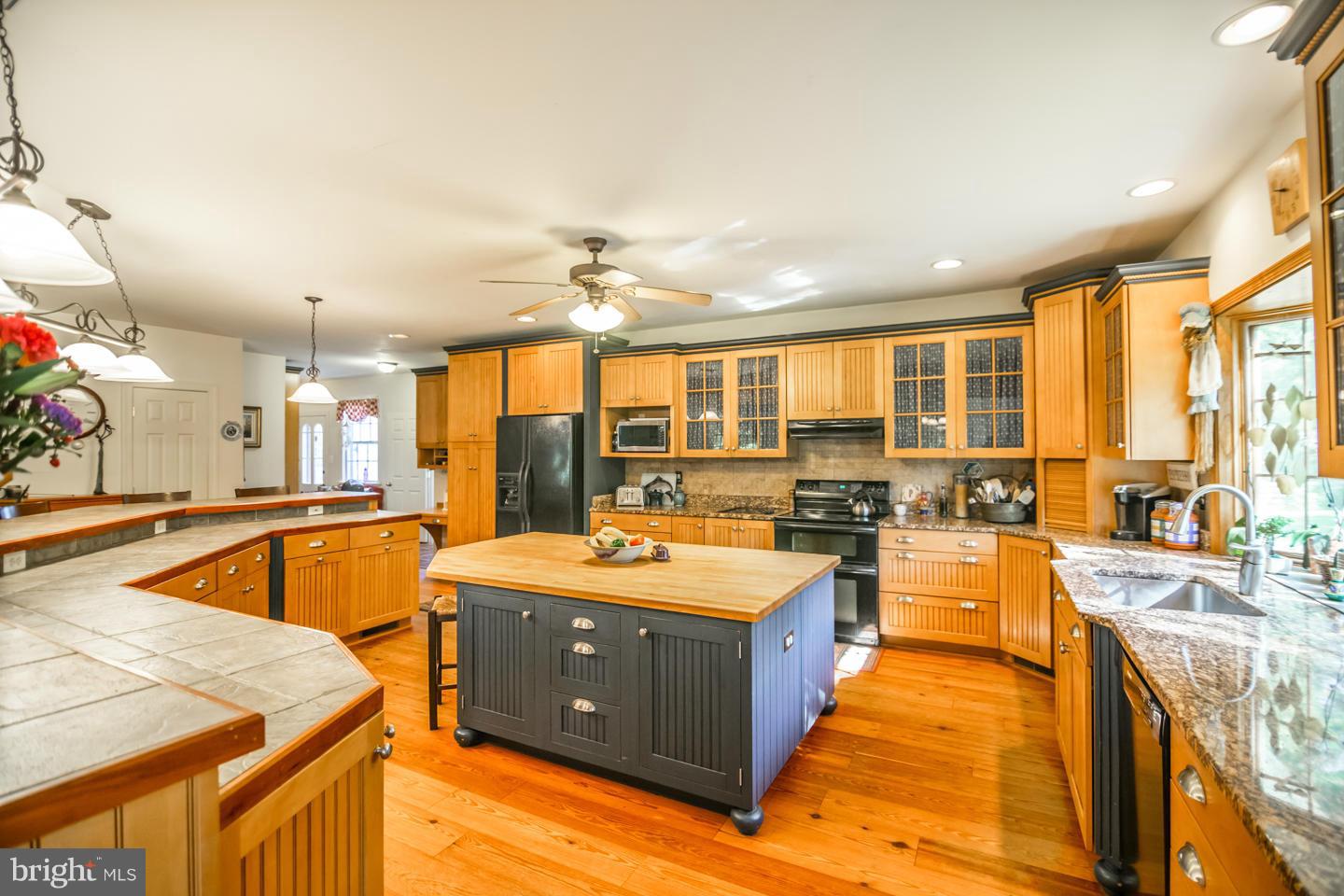 3900 Chaneyville Road Owings, MD 20736 - Photo 10 of 30 a large kitchen with kitchen island a large window