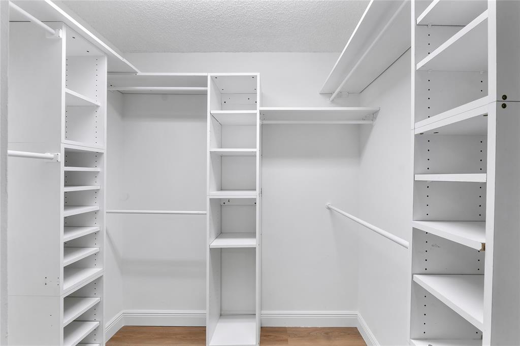 7763 Southampton Terrace, Unit 102 Tamarac, FL 33321 - Photo 17 of 73 a view of walk in closet with empty racks