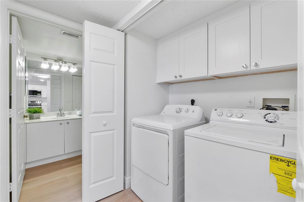 7763 Southampton Terrace, Unit 102 Tamarac, FL 33321 - Photo 29 of 73 a utility room with dryer and washer