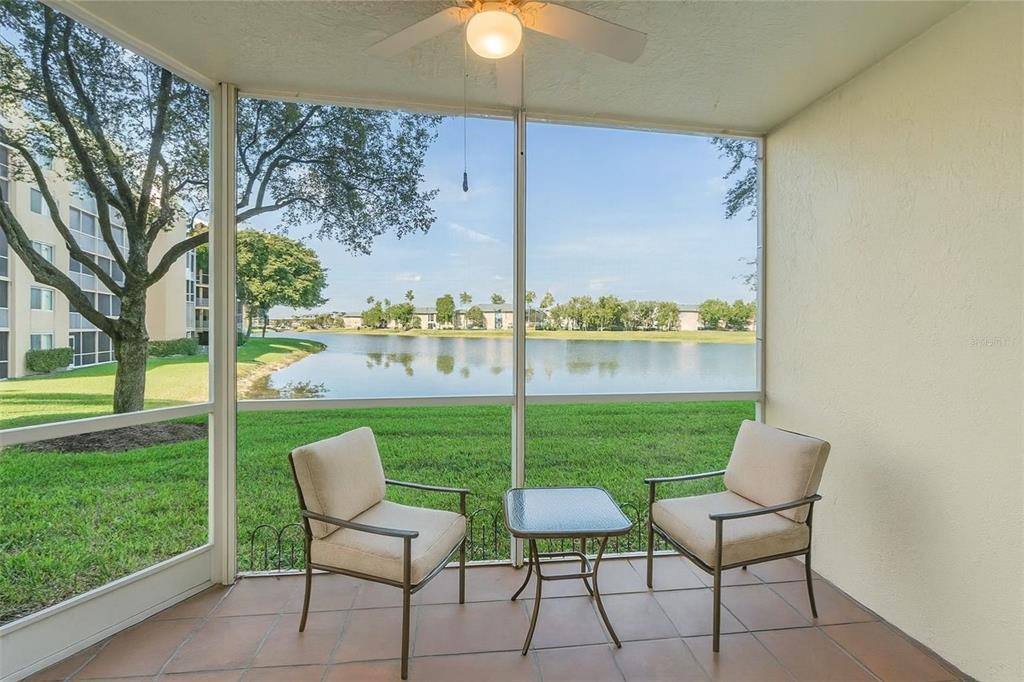 7763 Southampton Terrace, Unit 102 Tamarac, FL 33321 - Photo 33 of 73 a view of a chairs and table in patio with a yard