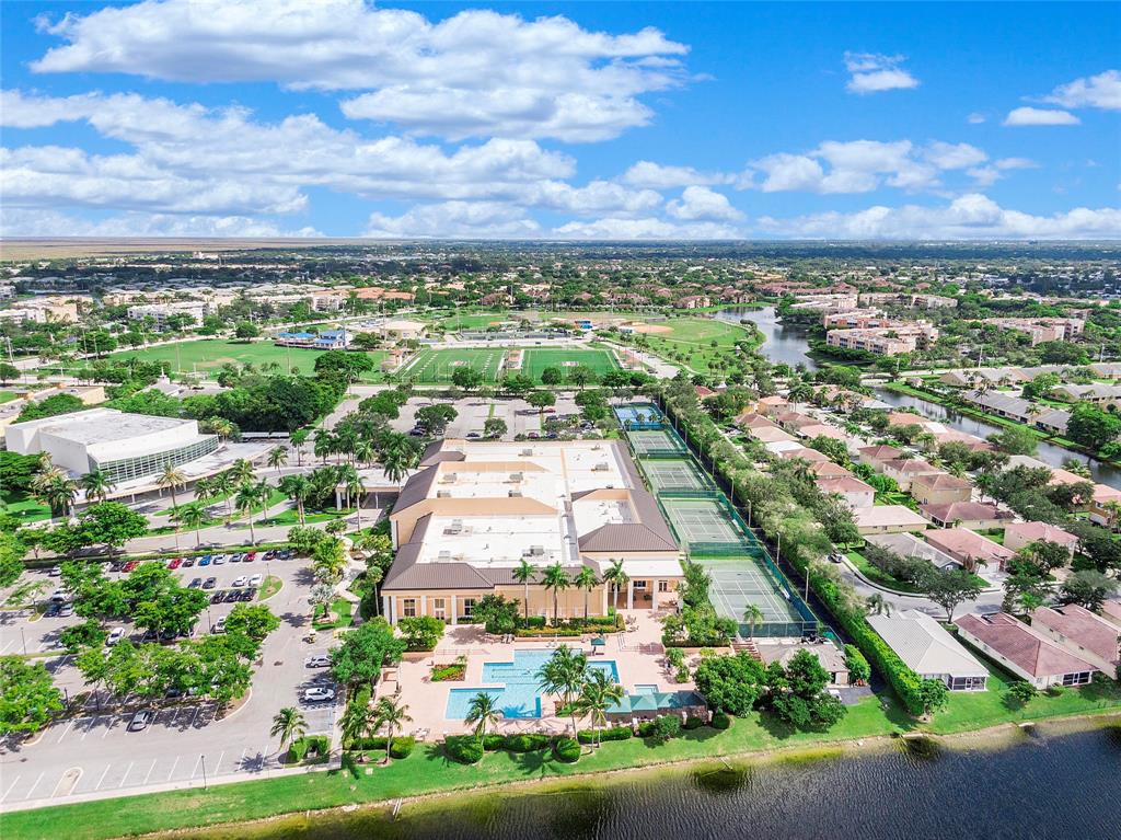 7763 Southampton Terrace, Unit 102 Tamarac, FL 33321 - Photo 40 of 73 an aerial view of residential building with green space