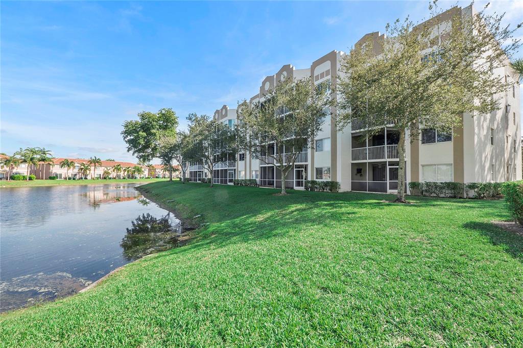 7763 Southampton Terrace, Unit 102 Tamarac, FL 33321 - Photo 4 of 73 a view of a house with a yard and sitting area