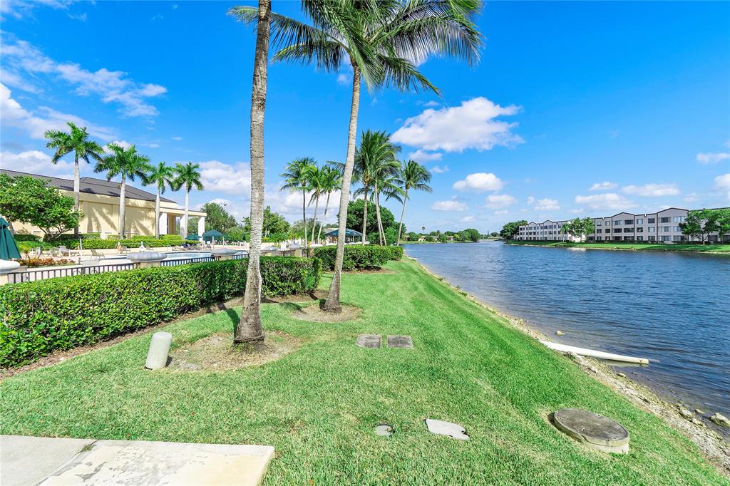 7763 Southampton Terrace, Unit 102 Tamarac, FL 33321 - Photo 60 of 73 a view of a garden with a lake