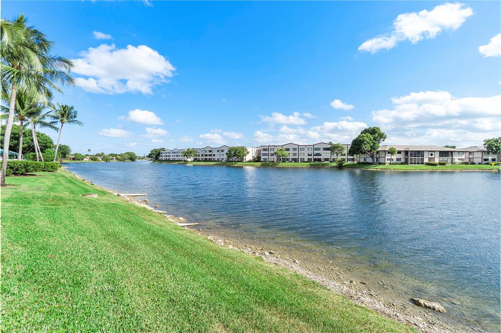 7763 Southampton Terrace, Unit 102 Tamarac, FL 33321 - Photo 61 of 73 a view of a lake with houses in the back