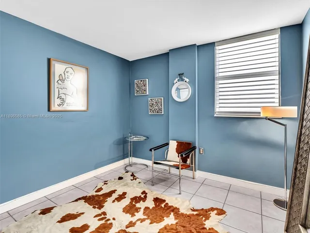 a view of a livingroom with wooden floor and a window
