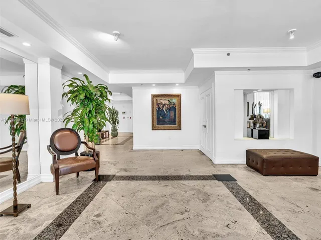 a view of a hallway with potted plants