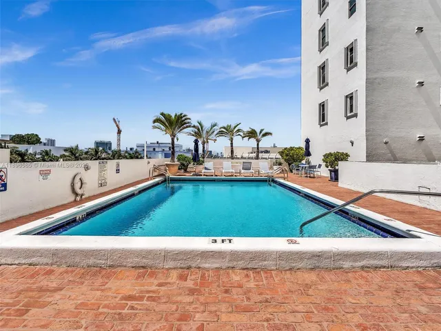 a living room with lots of furniture and a chandelier