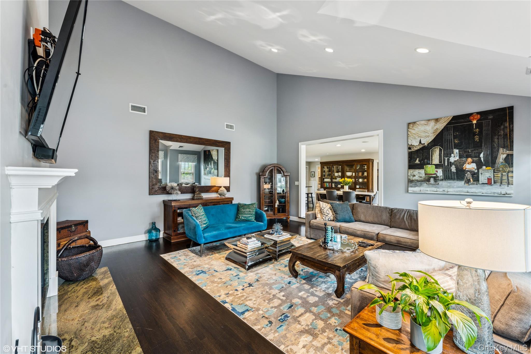 15 Flamingo Road East Hills, NY 11576 - Photo 11 of 41 Living area featuring wood finished floors, high vaulted ceiling, recessed lighting, and a fireplace